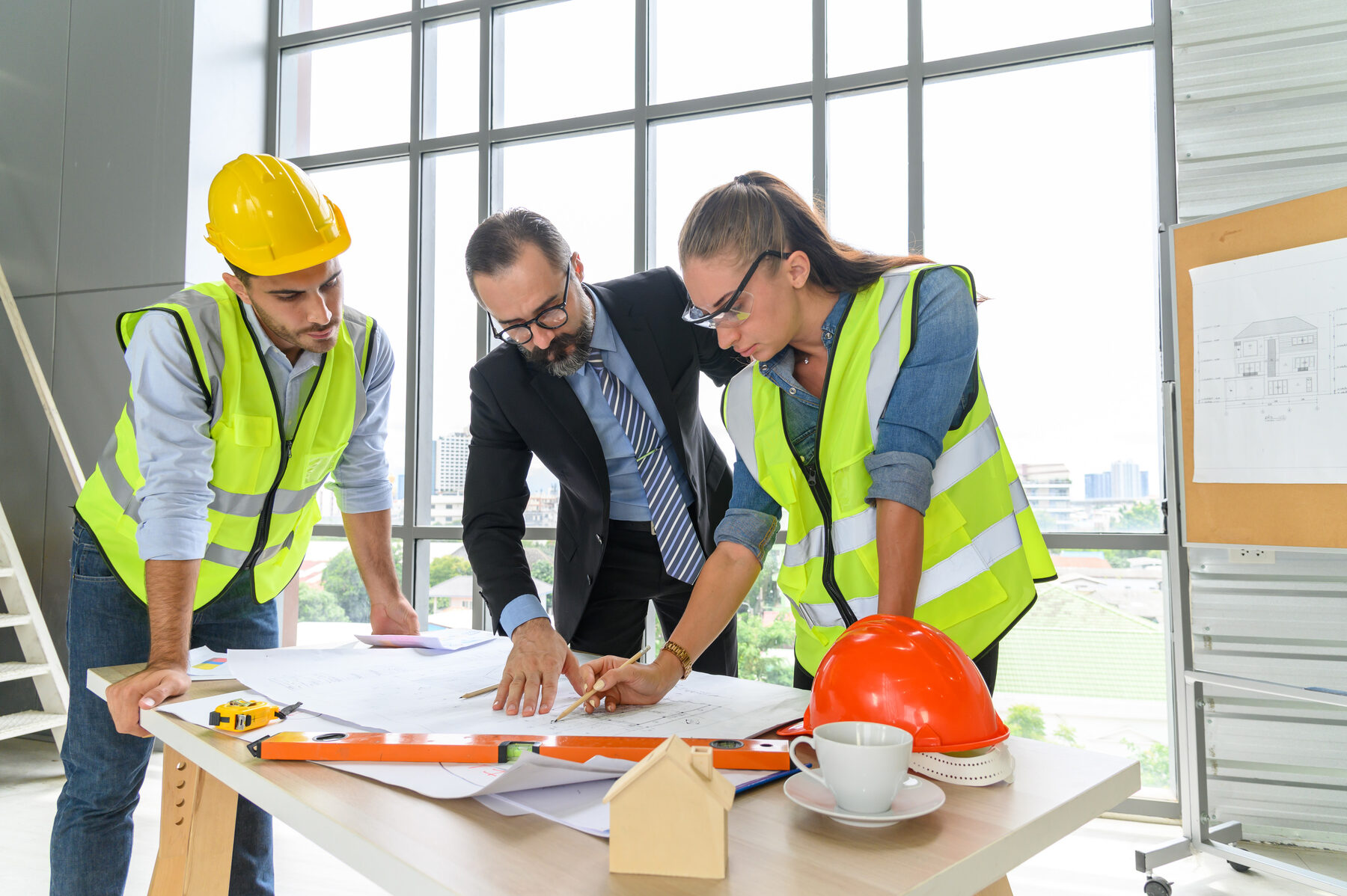 EOCT engineers reviewing plans on site